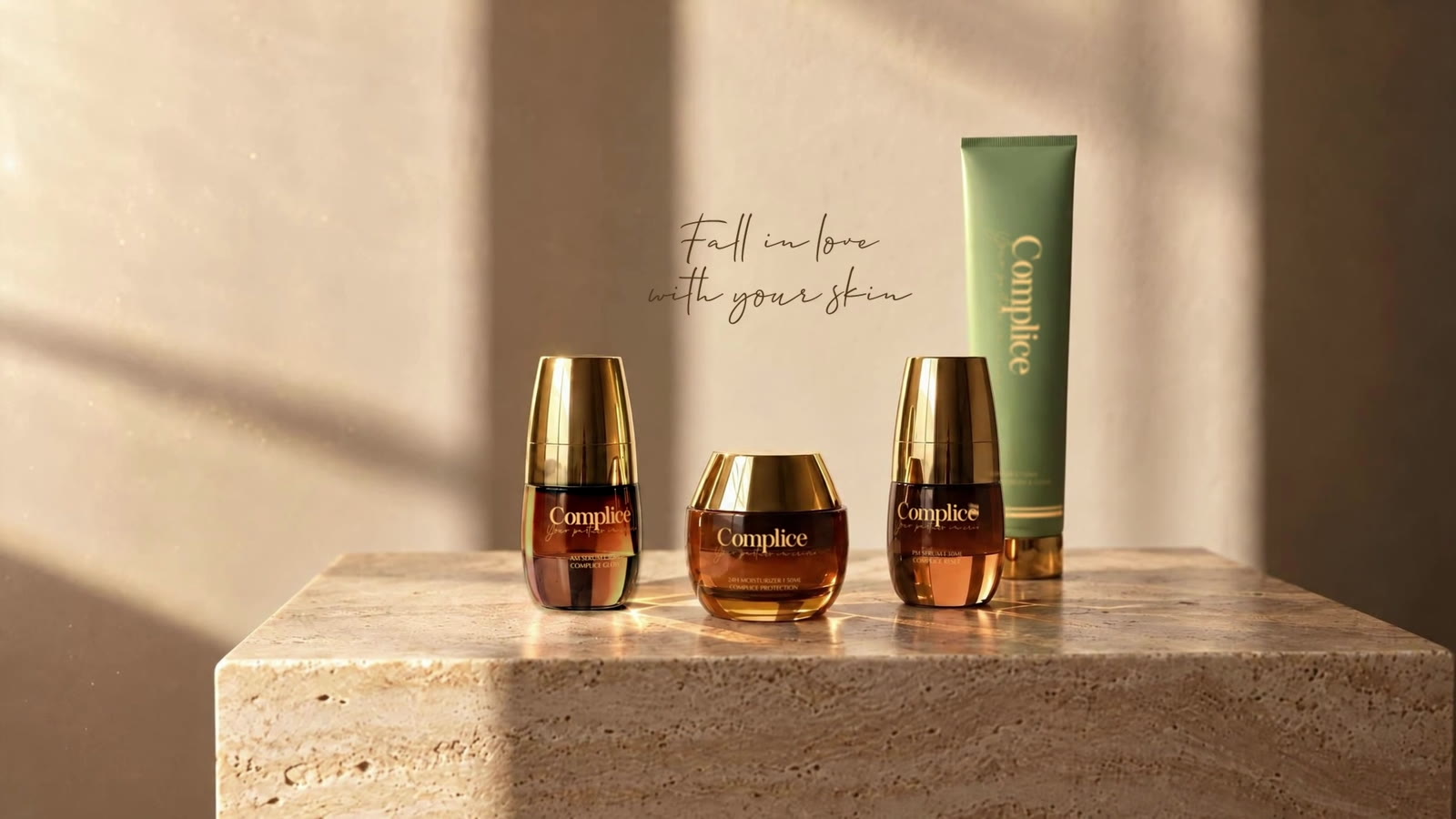 The four Complice products on travertine with the line Fall in love with your skin