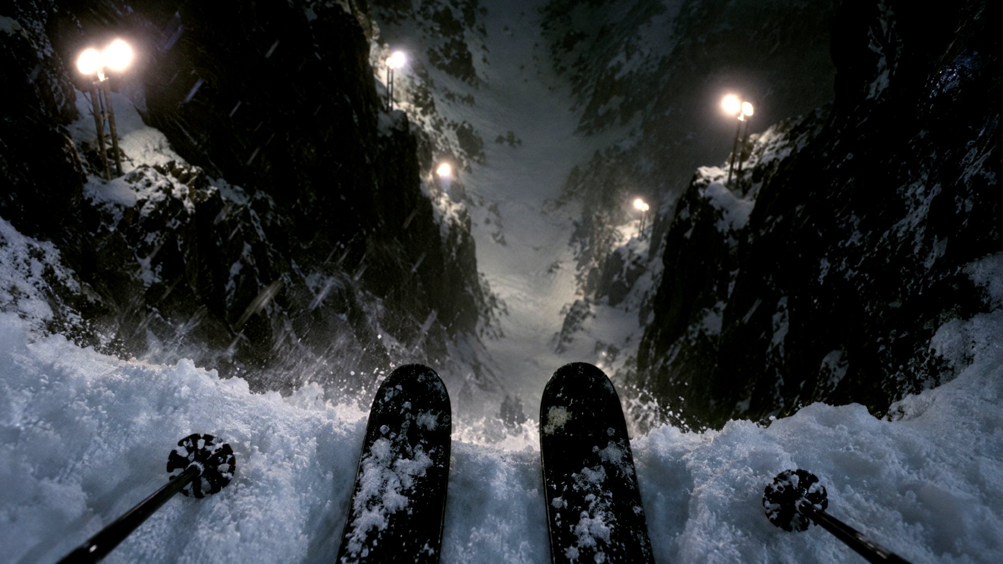 Ski tips at the lip of the couloir