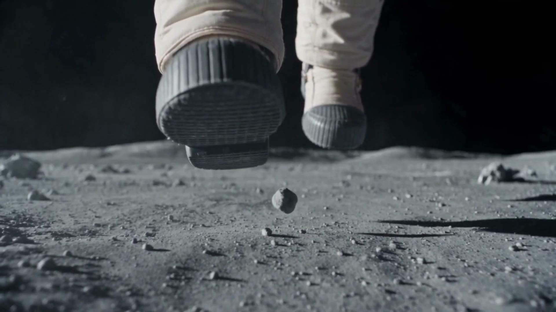 An astronaut's boots frozen mid-stride on the moon