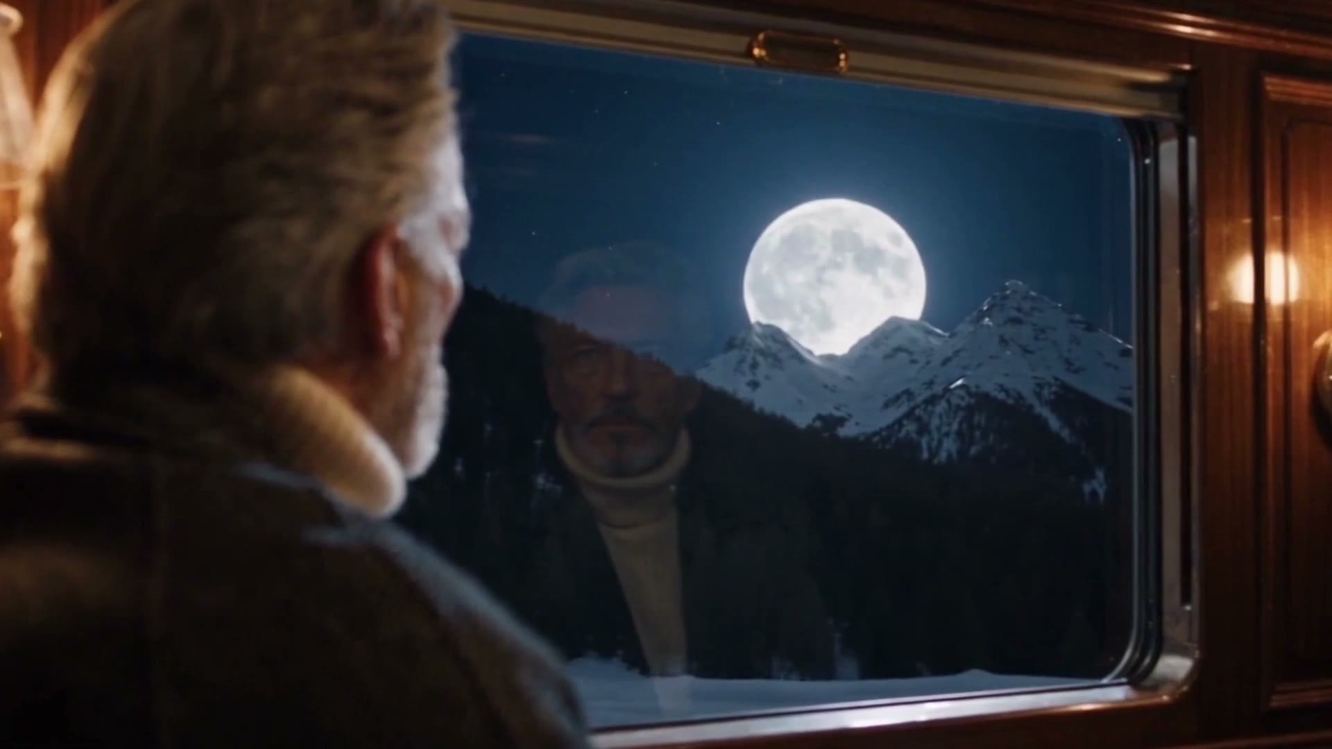 A full moon rising in the train window
