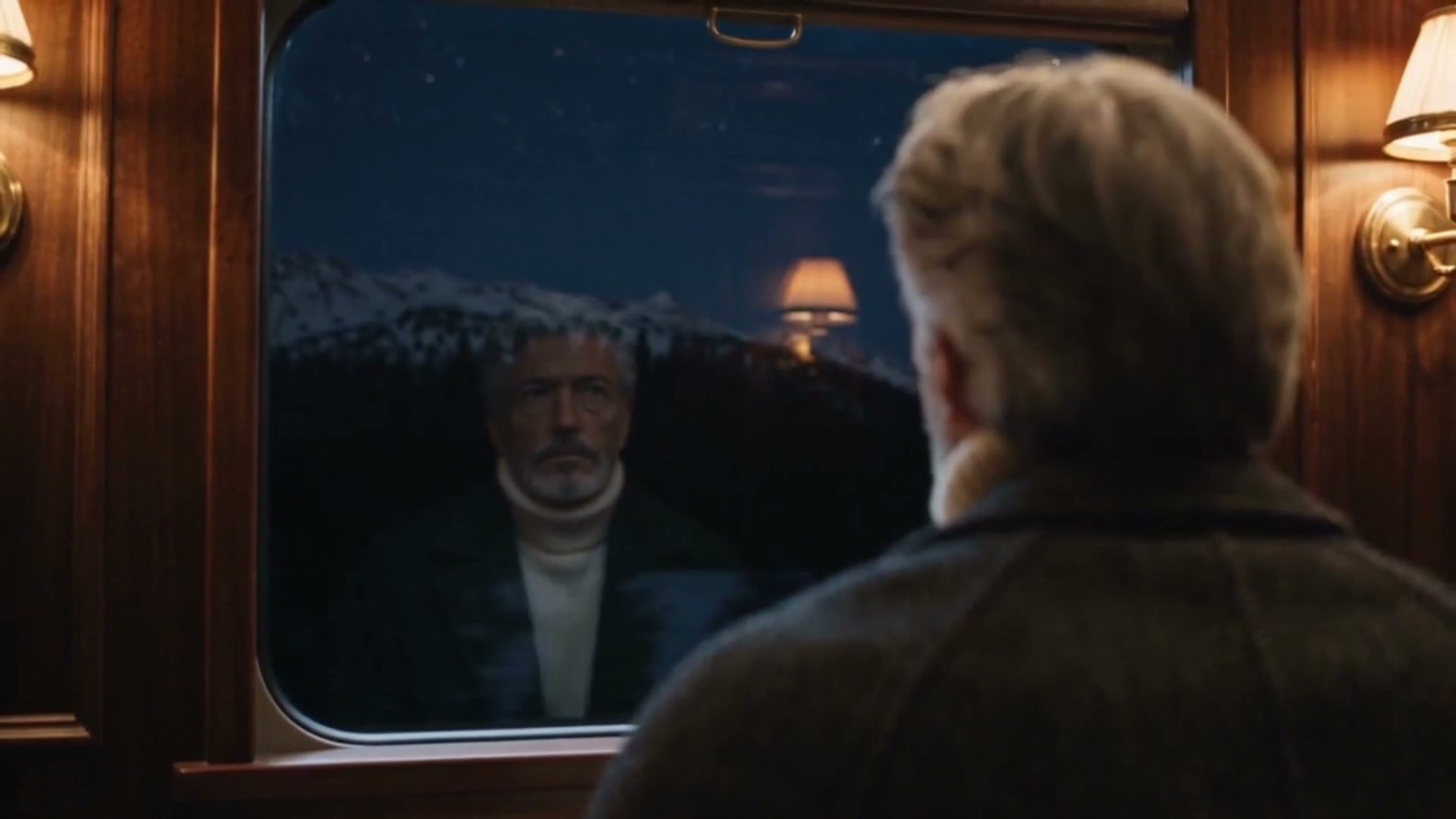 The father at the train window, an empty sky over the mountains