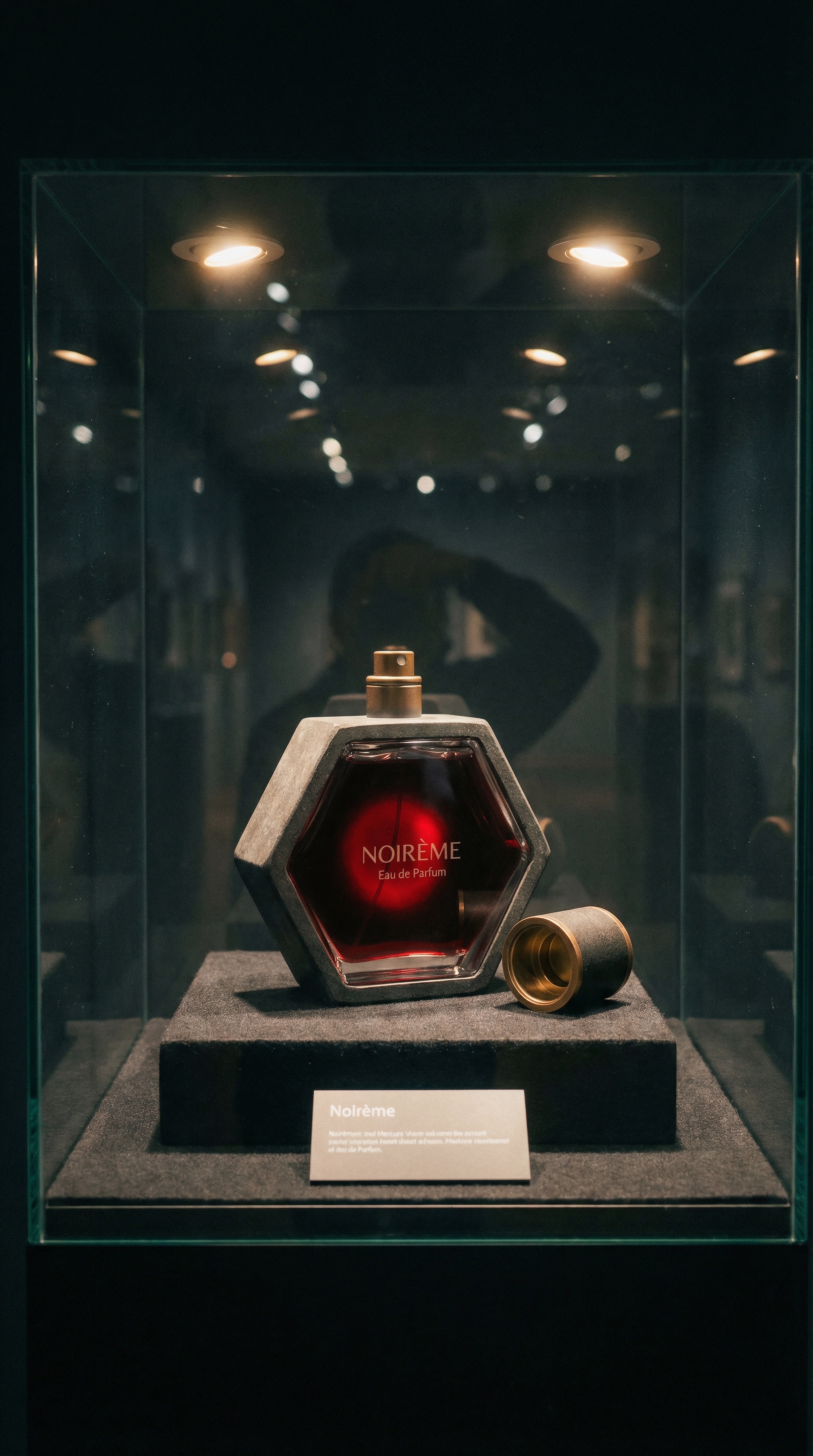 Noir&egrave;me — The Vitrine: bottle in glass museum case